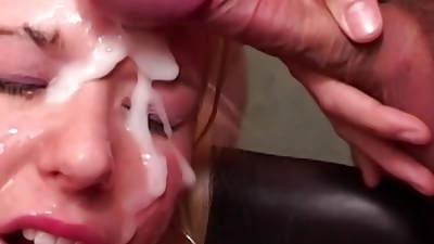 A hot blonde babe from Germany gets her face covered with cum after a gangbang