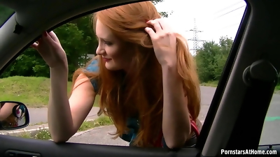Redhead sucking dick in a car