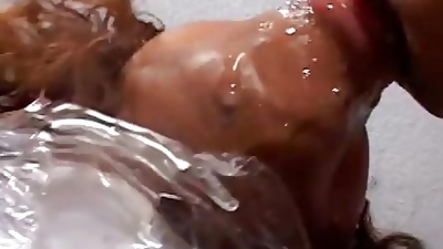 Dude has his own black doll wrapped in cellophane ready to use for a fuck session