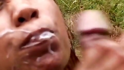 Black slut gets oiled up by her Latino lover and they fuck outdoors