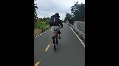 Hot ass woman biking in skin tights on public trail