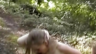 Two fabulous German babes sharing a loaded pecker in the woods
