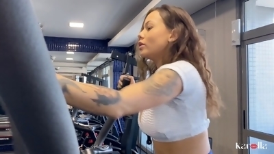 Horny brown-haired gives her gym instructor a blowjob in the bathroom