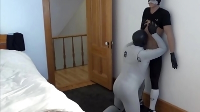 guy in bastard wetsuit captures masked thief sex doll thief