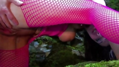 This young couple is quite adventurous as they enjoy outdoor anal sex in the forest