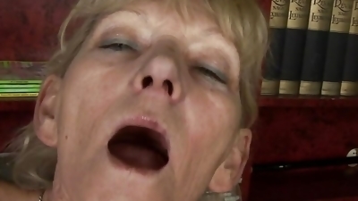 A horny German granny gets her hairy twat sprayed with cum