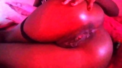 Mature black woman comes hard anally while playing with both holes
