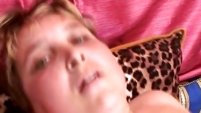 A stunning blonde MILF getting a big load of cum inside her mouth