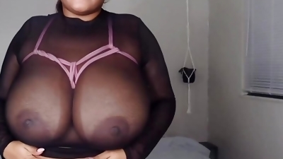 A masturbator with Huge Black tits in pink ropes