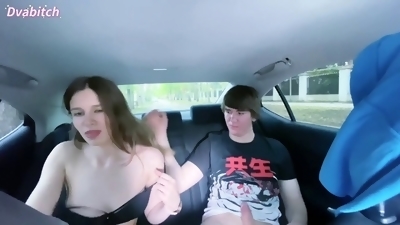 Petite brunette gets fucked in a car with people walking by