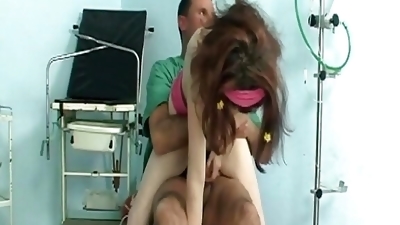 A magnificent brunette teen gets her muff smashed by a doctor's hard cock