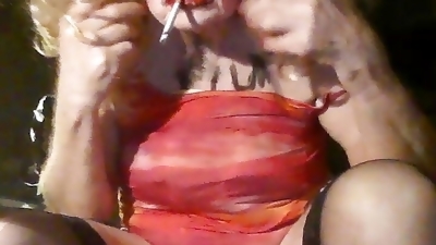 Sissy fag slut cross-dresser inserts 8 inch black dildo up herself, masturbates, smokes
