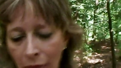 Old and horny lady pleasing a loaded cock in the woods