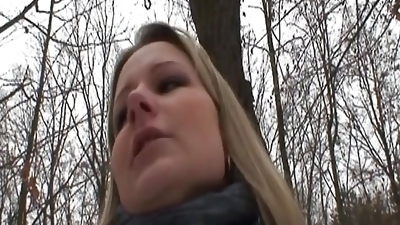 Good looking German lady pleasing a hard cock outdoors
