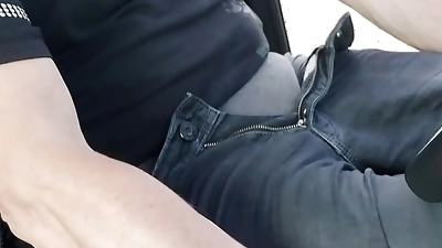 Gay guy jerks off in the car wearing a cock ring and condom