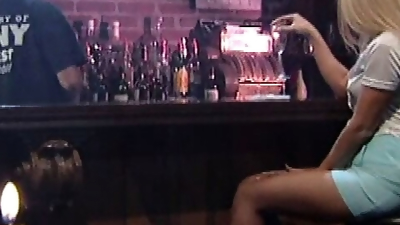 Two lesbians get to know each other at the bar where they