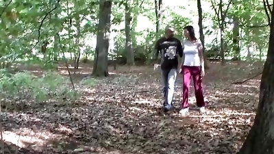 A sexy German slut gets a double cumshot in the middle of the woods