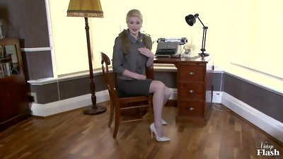 Stylish blonde teasing you in her office