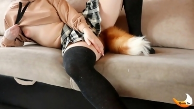 Naughty schoolgirl MadamFox has fun playing with her fox tail butt plug and masturbating to orgasm