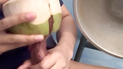 Thai guy make coconut milk.
