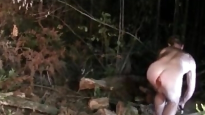 Naked in the forest cutting firewood with plug in my ass before riding huge dildo on bonnet of car